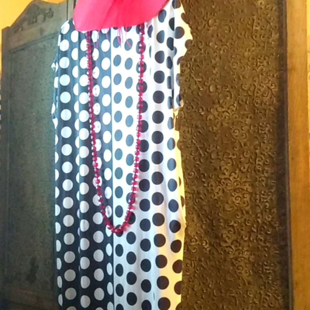 Beautiful black and white pocketed polka dot dress. Size medium to large dress